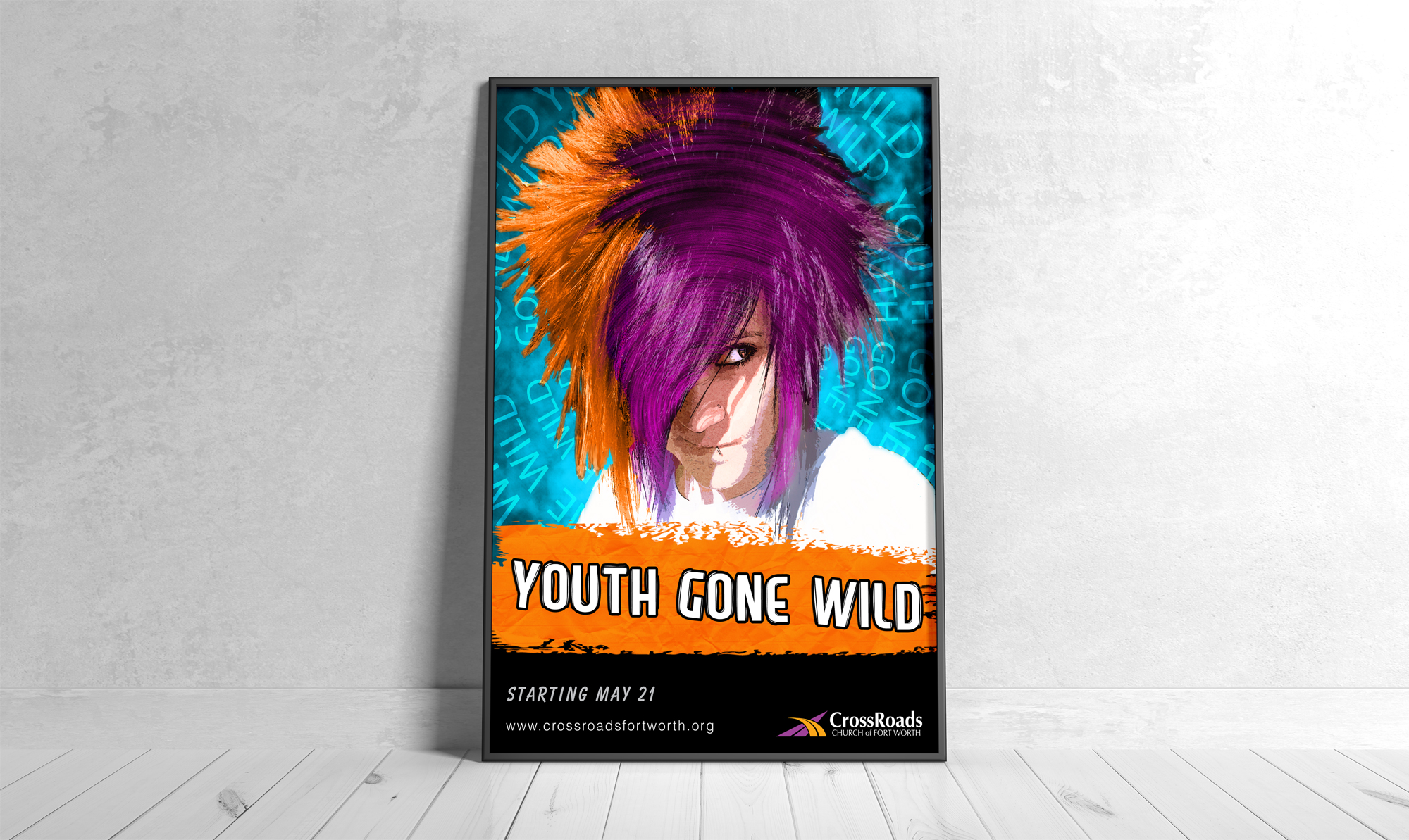 Framed promotional poster display for CrossRoads Church featuring vibrant custom illustrated artwork and bold typography for a Youth Gone Wild event.