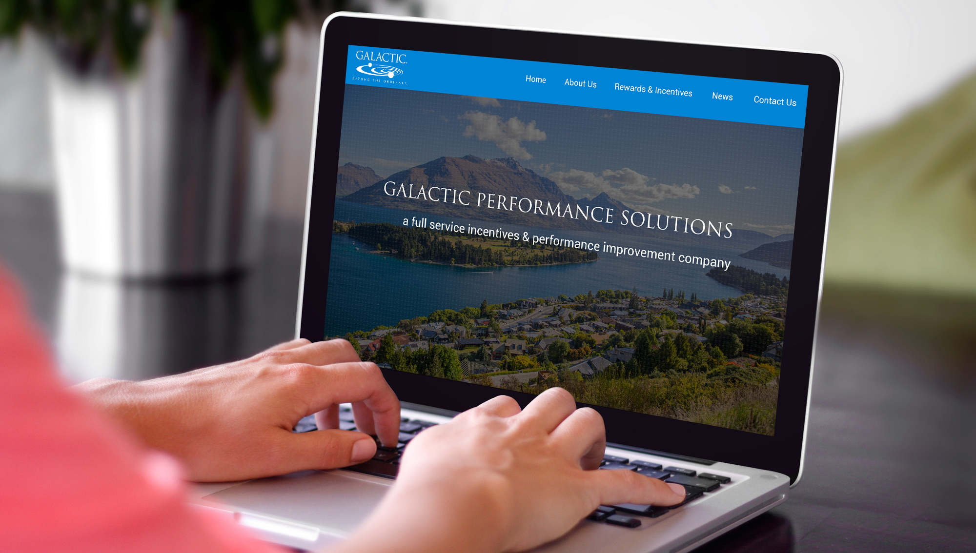 Laptop mockup displaying a responsive web user interface design strategy for Galactic Performance Solutions' homepage layout.